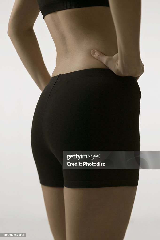 Young woman with slim body, posing in studio, portrait, close-up