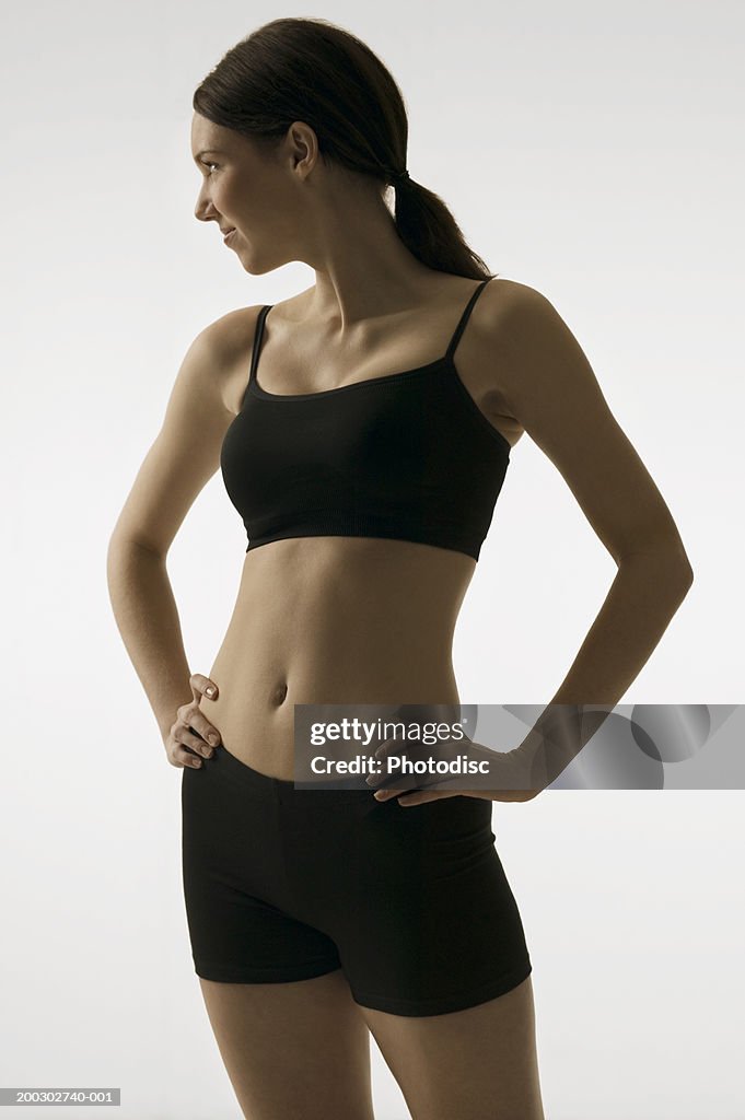 Young woman with slim body, posing in studio, portrait