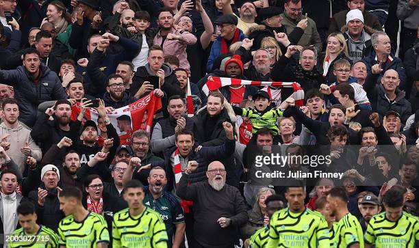 Arsenal fans celebrate their teams 6th goal after Declan Rice of Arsenal scored it during the Premier League match between West Ham United and...