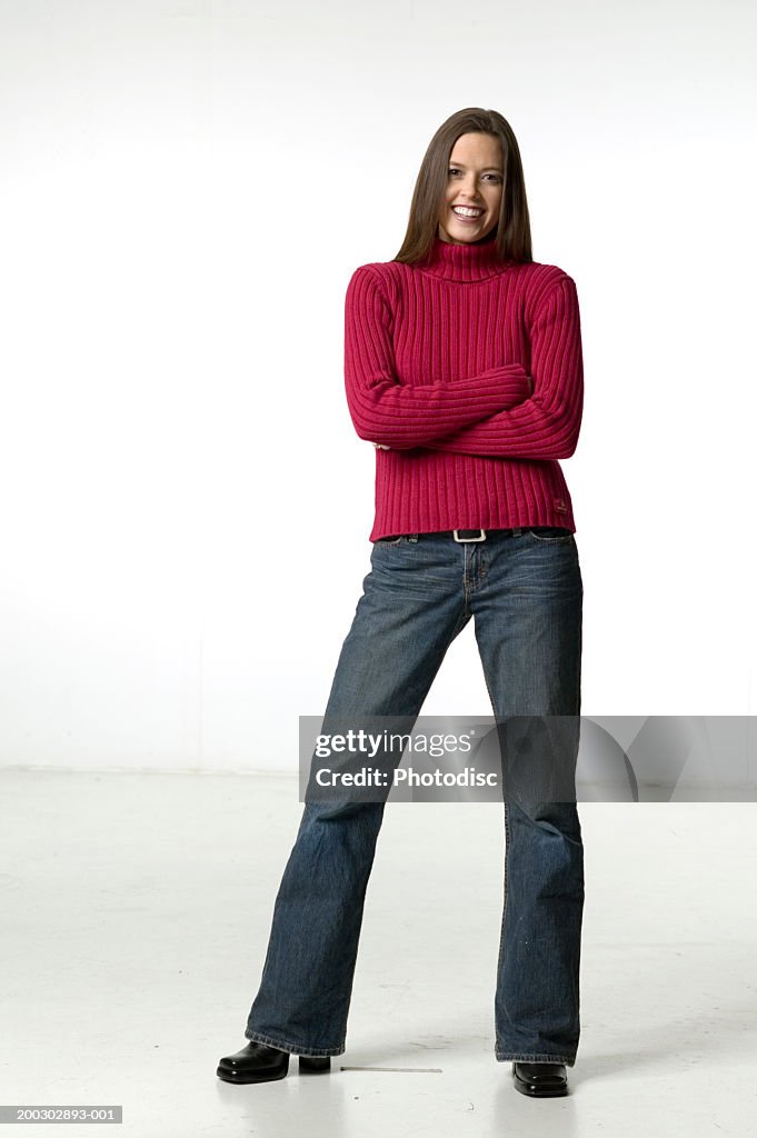 Woman with dark hair and brown eyes, posing in studio, portrait