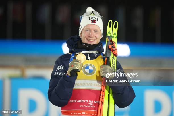 Gold medalist Johannes Thingnes Boe of Norway poses for a photo after the medal ceremony for the Men's 12.5k Pursuit at the IBU World Championships...