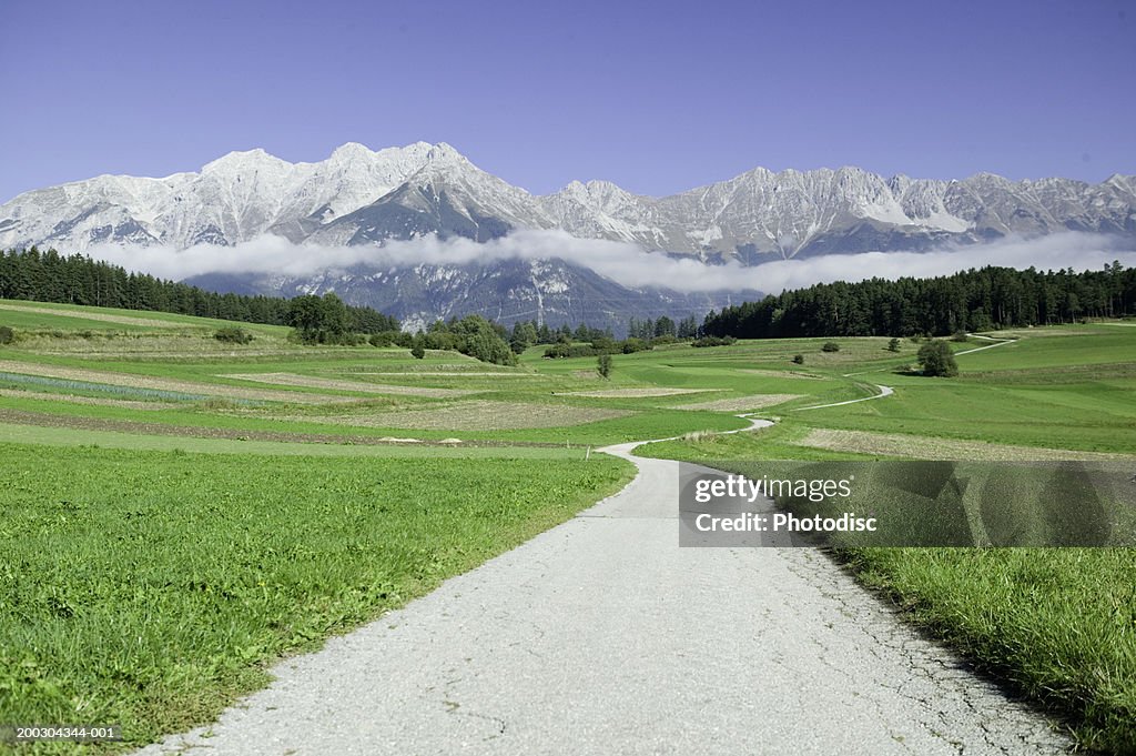 Dirt road and fields in mountains