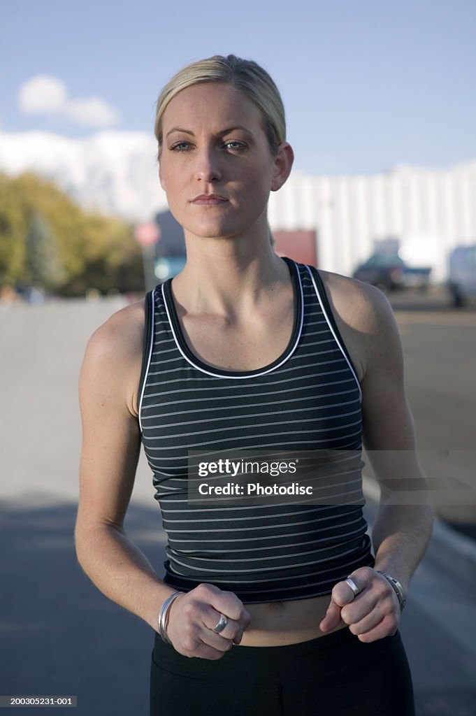 Young woman jogging on street