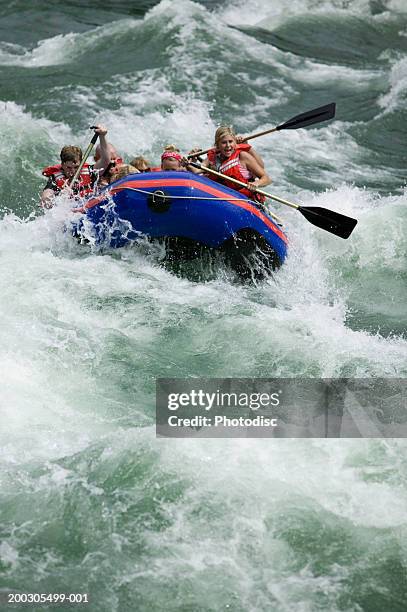 group of people white-water rafting on river, elevated view - white water rafting stock pictures, royalty-free photos & images