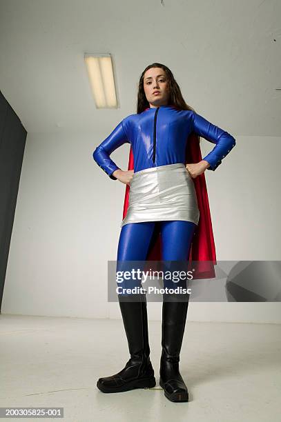 https://media.gettyimages.com/id/200305825-001/photo/young-woman-wearing-superhero-costume-posing-in-studio-portrait-low-angle-view.jpg?s=612x612&w=gi&k=20&c=7P8lgikKv2piXVb0X2_IDEB30MMrShVcViIvVw_YtHY=