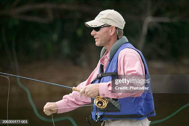 https://media.gettyimages.com/id/200305977-001/photo/man-wearing-sunglasses-fishing-on-river.jpg?s=612x612&w=gi&k=20&c=AG8AmQyriJVsRu35VdZIFulNPGVipTVw8uUuQIO1J6Y=