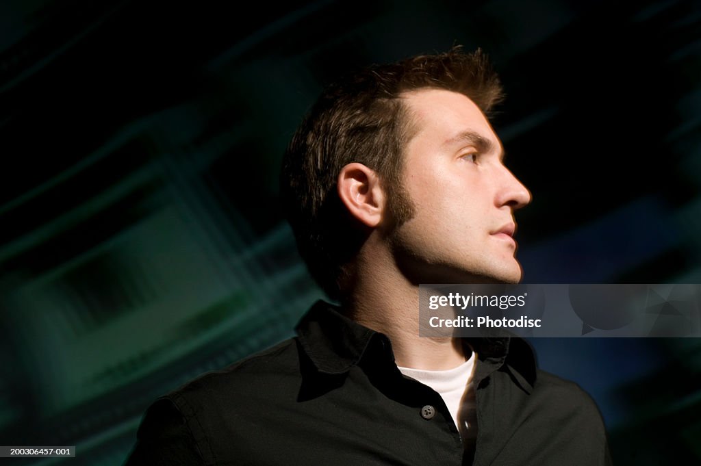 Man looking sideways, blurred background