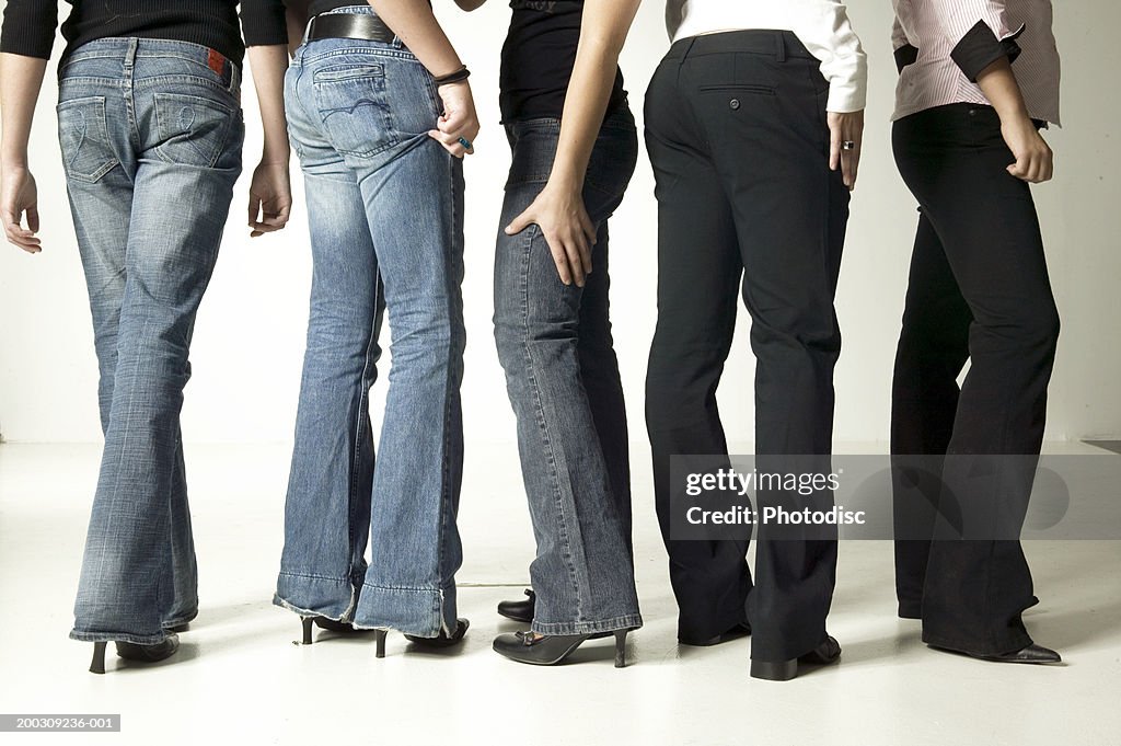 Women Wearing Denim Jeans Posing In Studio Low Section High-Res Stock
