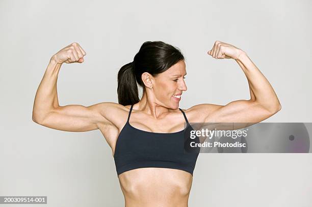 8,194 Woman Flexing Muscles Stock Photos, High-Res Pictures, and Images -  Getty Images