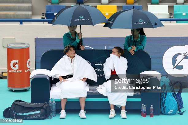 Sofia Kenin of the United States and Bethanie Mattek-Sands of the United States wait for a rain delay while playing against Linda Noskova of Czech...
