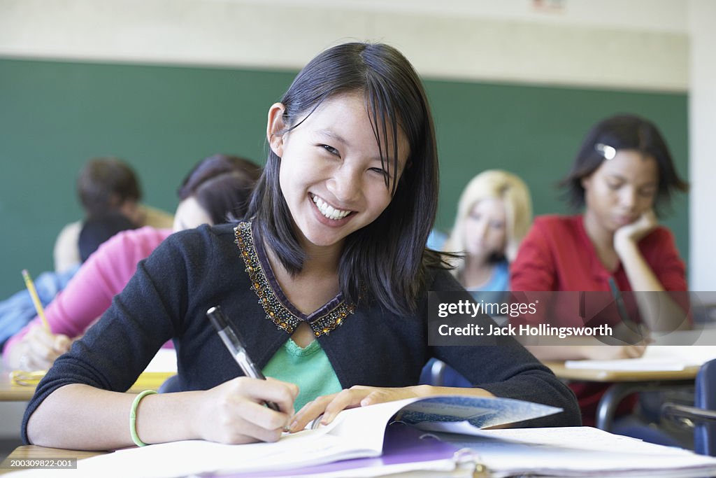 Portrait of a teenage girl sitting in a classroom