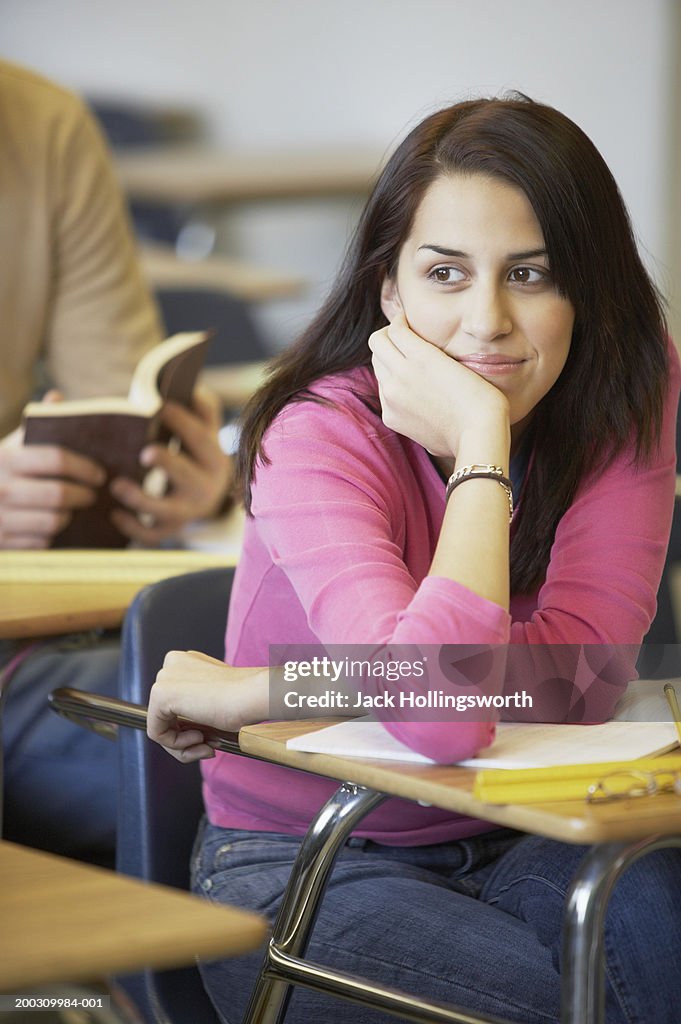 Teenage girl sitting in a classroom