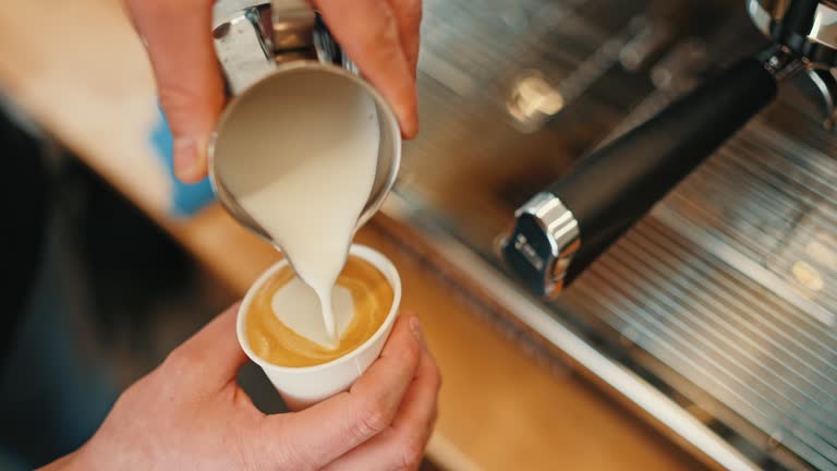 https://media.gettyimages.com/id/2003103368/video/closeup-of-male-food-truck-owner-pouring-steamed-milk-into-coffee-cup-and-makes-latte-art.jpg?b=1&s=640x640&k=20&c=V5UL85rwiwUsR8wUEeZCMtlEfx7rx7KoGnPlyZJyhuI=