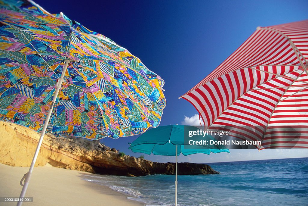 St Martin, colorful umbrellas on Cupecoy Beach