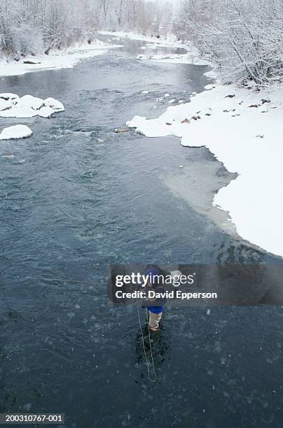 man fly fishing in yampa river, elevated view, winter - steamboat springs stock pictures, royalty-free photos & images