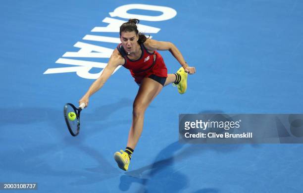 Sorana Cirstea of Romania plays a forehand against Sloane Stephens of the united States in their first round women's singles match during the Qatar...