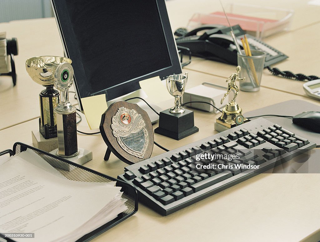 Trophies on office desk, close-up