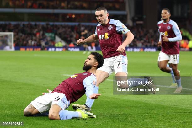 Douglas Luiz of Aston Villa celebrates with teammate John McGinn after scoring his team's first goal during the Premier League match between Aston...