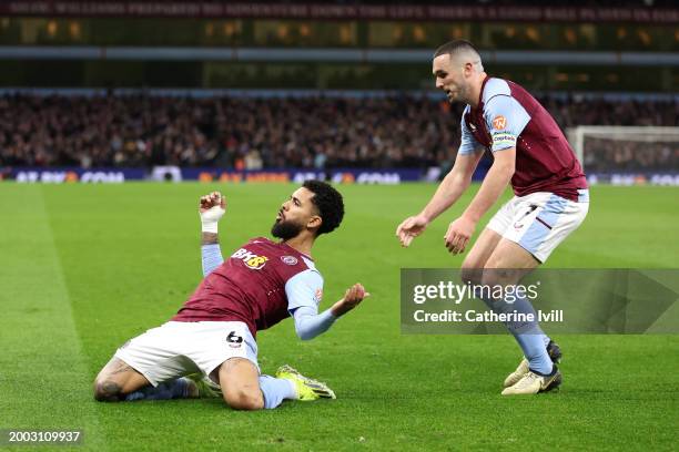 Douglas Luiz of Aston Villa celebrates with teammate John McGinn after scoring his team's first goal during the Premier League match between Aston...