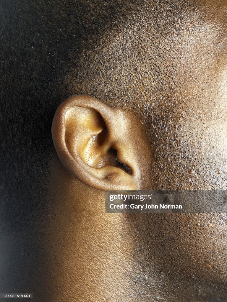 Young man's ear, side view, close-up