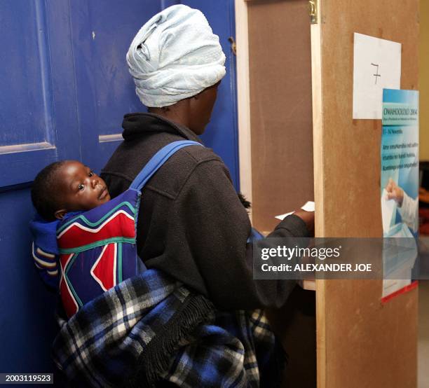 Namibian mother casts her vote in Windhoek in the county's general election 15 November 2004 in Windhoek, Current president Sam Nujoma has...