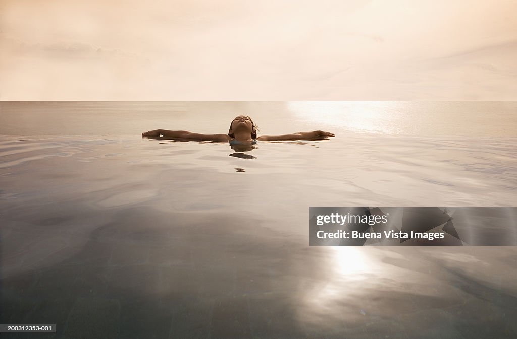 Young woman floating in sea