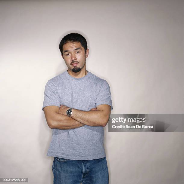 man with arms folded, portrait - frowning stock pictures, royalty-free photos & images