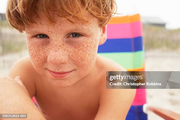 boy (6-8) on beach, close-up, portrait - freckles ストックフォトと画像