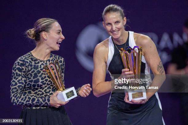 Ana Bogdan of Romania with her runner up trophy and Karolina Pliskova of Czech Republic with her champion trophy after final match against during...
