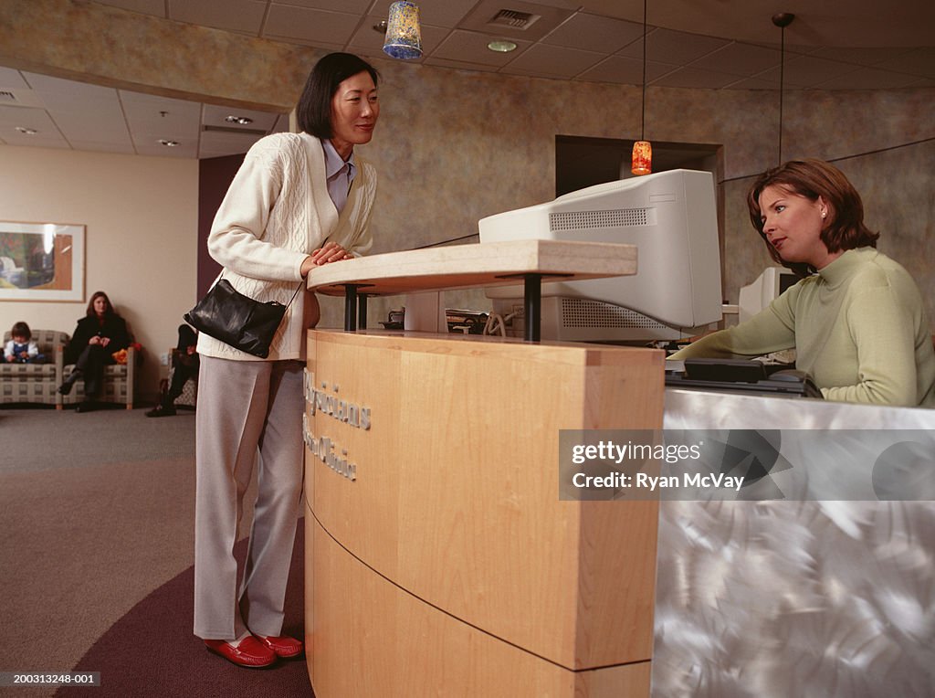 Woman standing at clinic reception