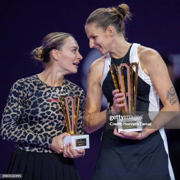 Ana Bogdan of Romania with her runner up trophy and Karolina Pliskova of Czech Republic with her champion trophy after final match against during...