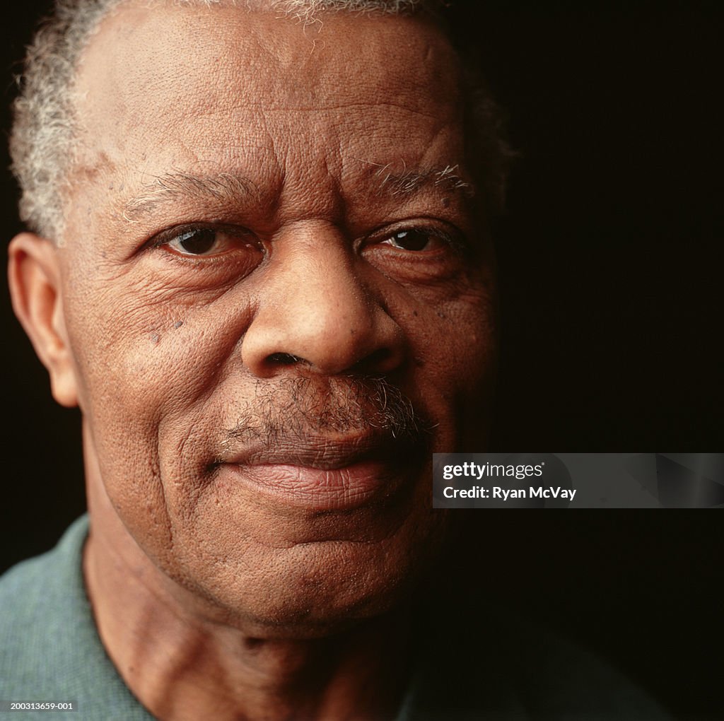 Senior man with moustache, posing in studio, close-up, portrait