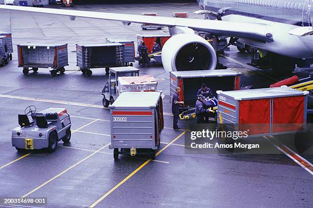 cargo plane and containers on runway, elevated view - airport cargo stock pictures, royalty-free photos & images