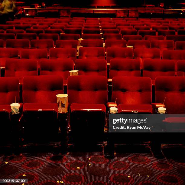 view of rows of empty cinema seats - kinosaal stock-fotos und bilder