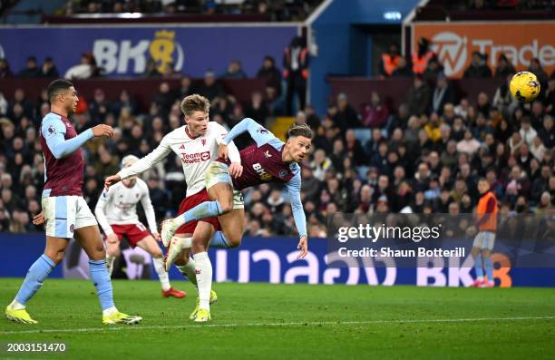 Scott McTominay of Manchester United scores his team's second goal from a header under pressure from Matty Cash of Aston Villa during the Premier...