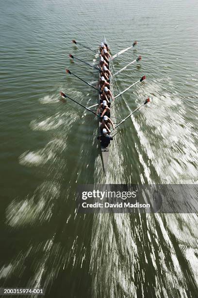 eight person rowing shell with coxswain (blurred motion) elevated view - coxswain stock pictures, royalty-free photos & images