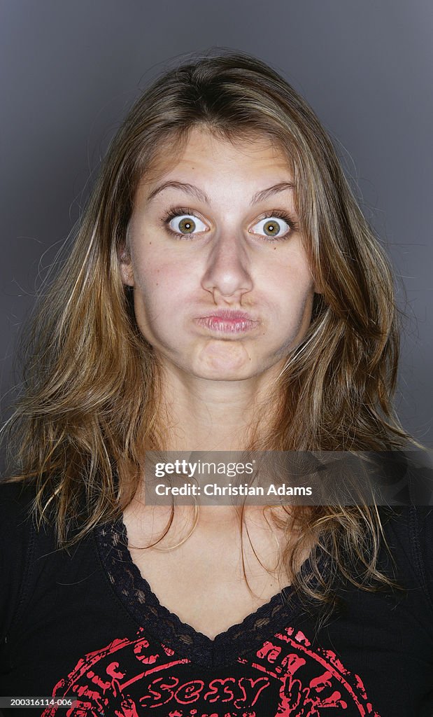 Young woman pulling face, portrait, close-up