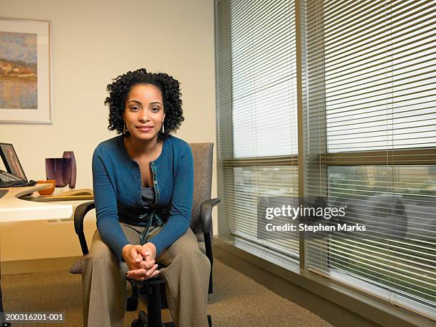 businesswoman smiling in office, portrait - stephen marks stock pictures, royalty-free photos & images