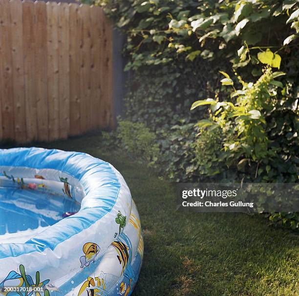 inflatable pool in back yard - inflatable swimming pool stock pictures, royalty-free photos & images