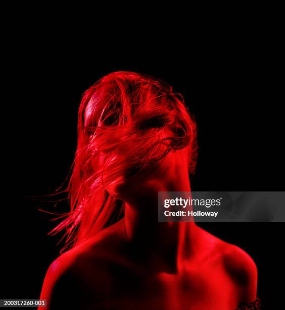 young woman dancing, turning head, eyes closed, close-up - euforie stockfoto's en -beelden