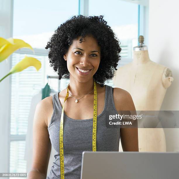 woman designer in studio smiling, portrait - one mid adult woman only fotografías e imágenes de stock