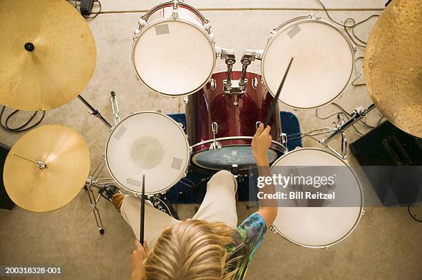 teenage boy (13-15) playing drums, overhead view - drum top view stock-fotos und bilder