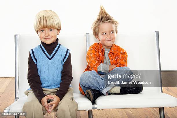 twin boys (3-5) wearing formal and casual attire, portrait - twins boys stockfoto's en -beelden