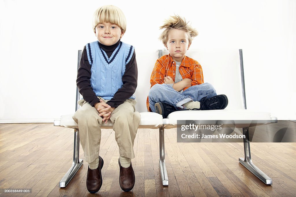 Twin boys (3-5) wearing formal and casual attire, portrait