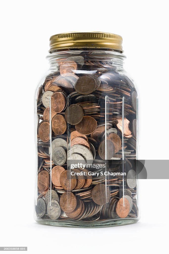 Jar filled with US coins