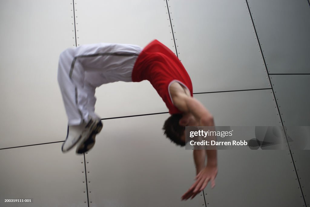 Backflip Inmotion Young Man Doing Backflip Mid Air Blurred Motion High-Res Stock Photo ...