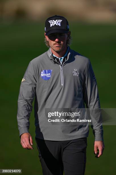 Jake Knapp of the United States walks on the 15th green during the continuation of the third round of the WM Phoenix Open at TPC Scottsdale on...