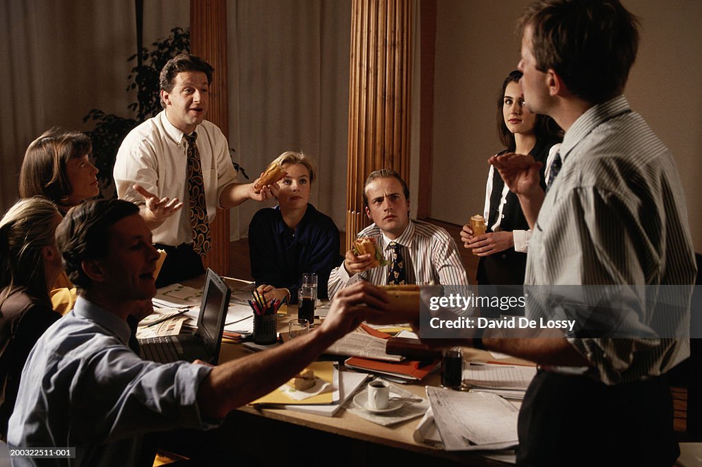 Group of business people discussing in board room