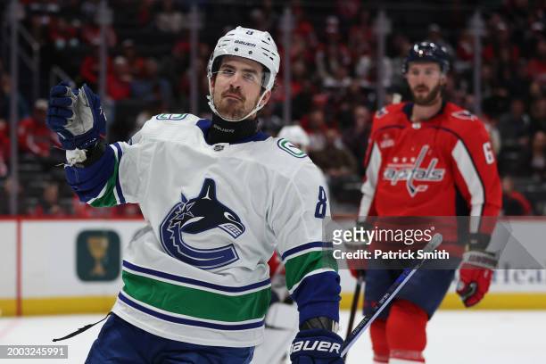 Conor Garland of the Vancouver Canucks celebrates after scoring a goal against the Washington Capitals during the first period at Capital One Arena...