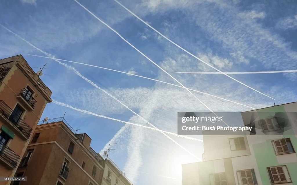 Trails of aircrafts in the sky in Barcelona, Spain